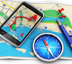 Smartphone on a map with compass and pen Smartphone on a map with compass and pen