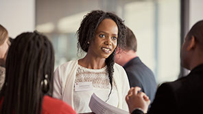 Professionals in a discussion at a business event