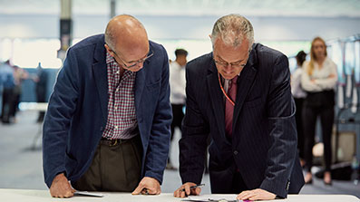 Two male professionals working together 