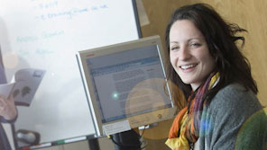 Smartly dressed person working at a computer Smartly dressed person working at a computer