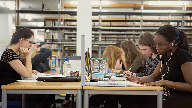 Students working in a library