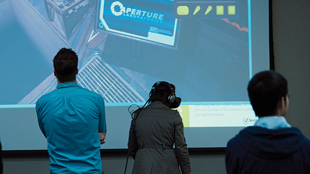 Students interacting with a game