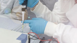 Students using equipment in a science lab