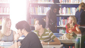 Students working in a library Students working in a library
