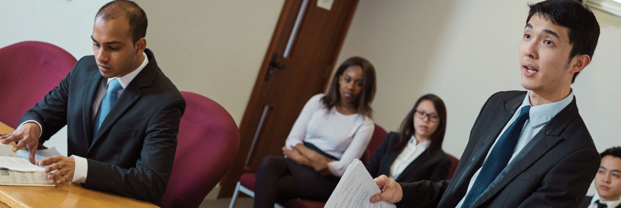 Law degree students taking part in law court simulation