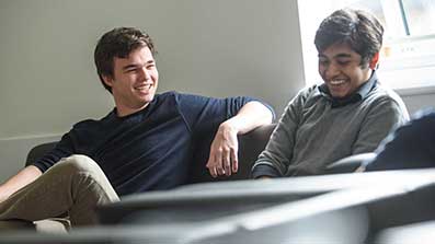 Accommodation residents talking on a sofa