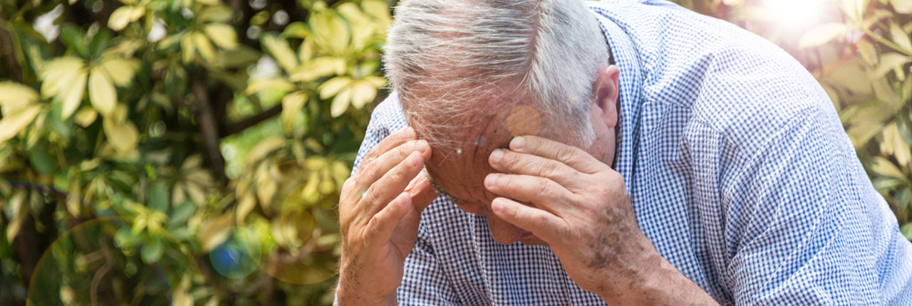 A senior citizen struggling with arthritis