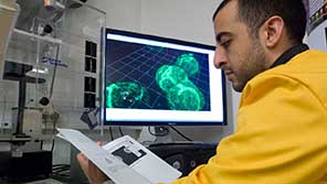 Biology student using microscope Biology student using microscope