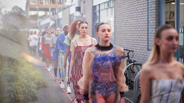 An audience watching a Bristol Distinguished Address Series lecture Fashion show at the Creative Industries Degree Show