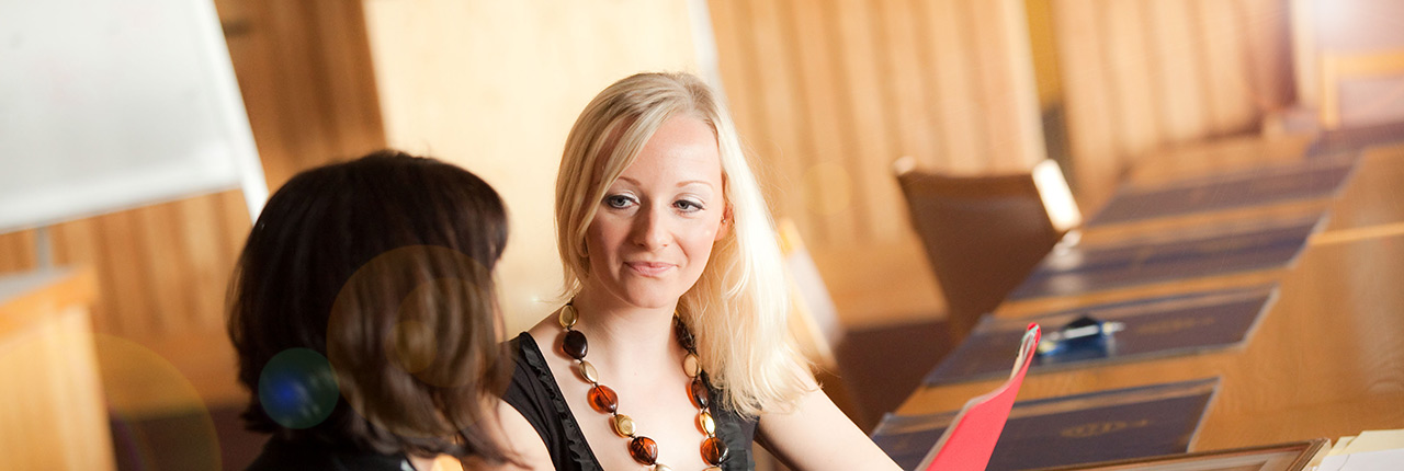 Young person being interviewed in a boardroom