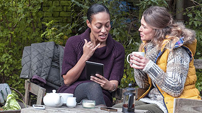 Two students talking in a garden Two students talking in a garden