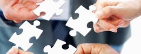 hands holding jigsaw pieces